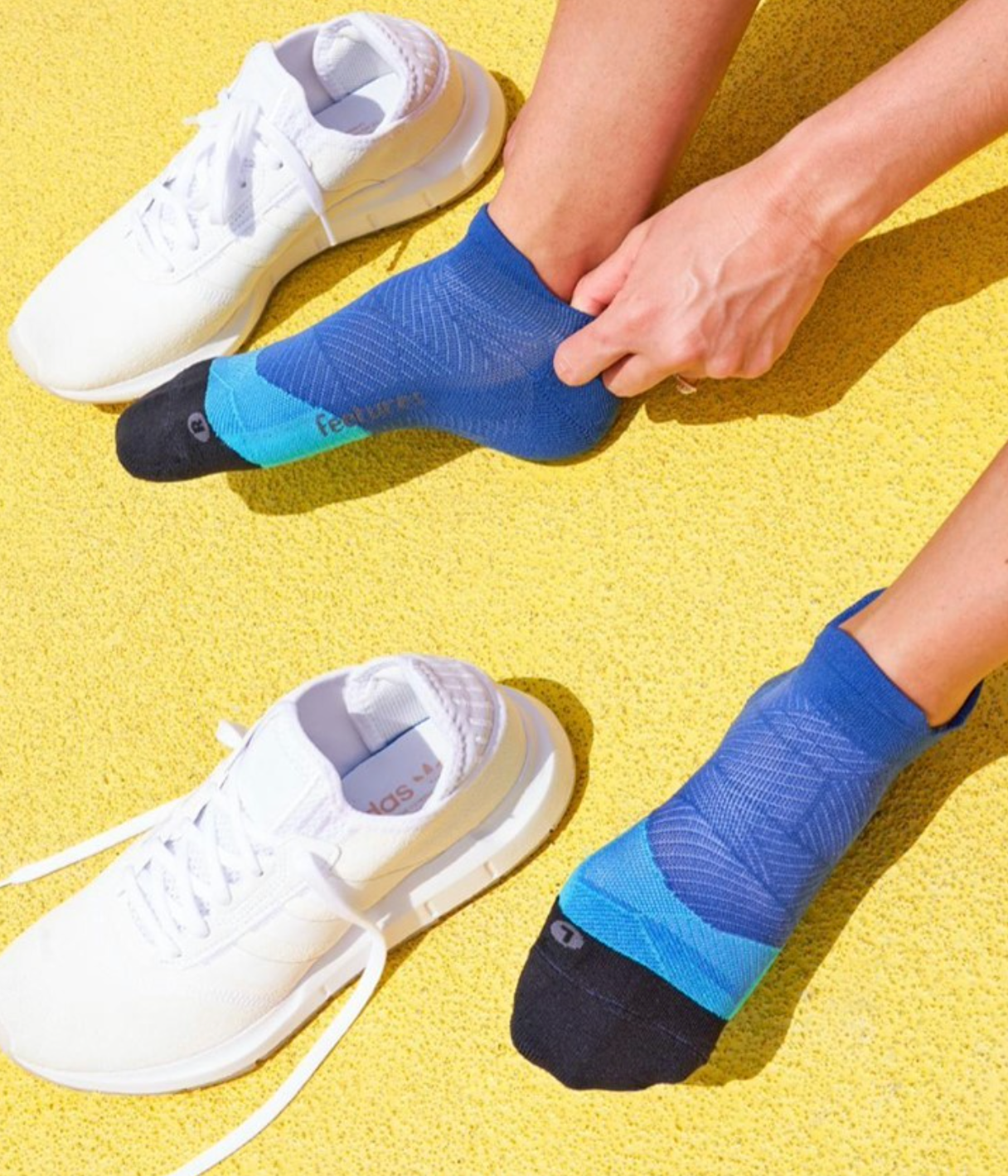 picture of someone putting on socks. click to shop socks.