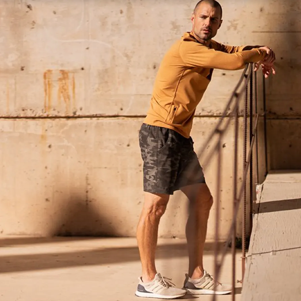 picture of man in athletic apparel. click to shop men's apparel.