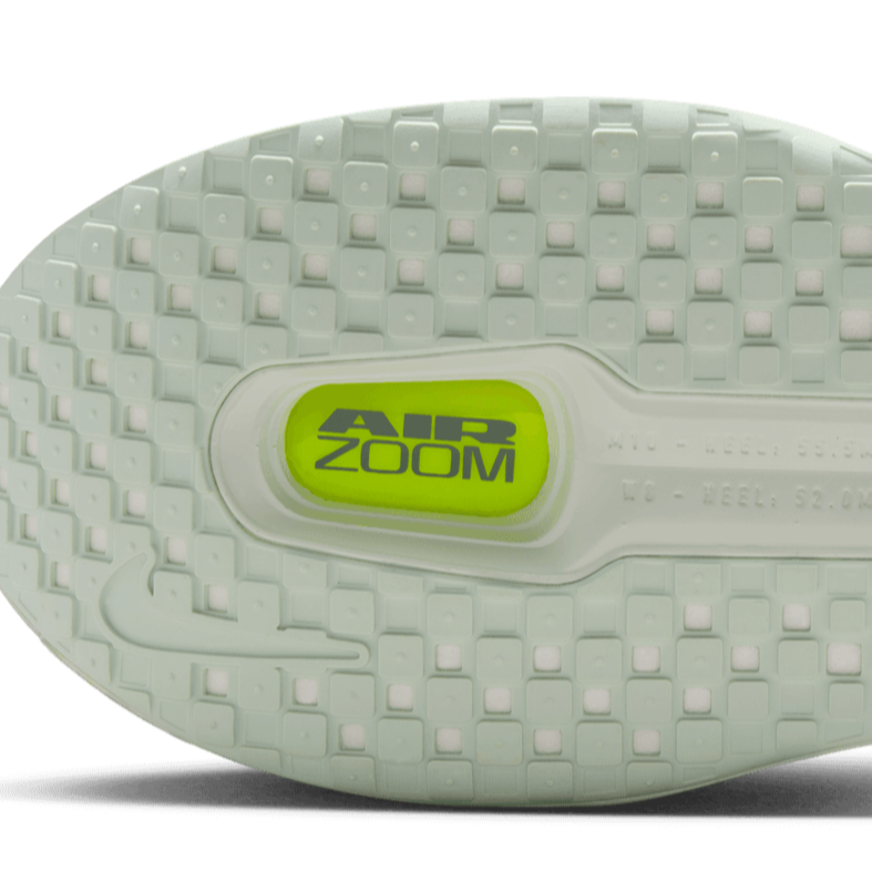 White running shoe sole with 'Air Zoom' branding on a gray background