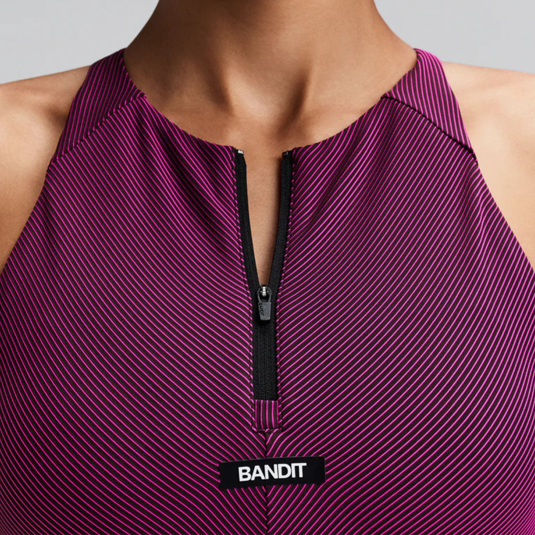 WOMEN'S STRIPED CADENCE ZIP FRONT RACE CROP