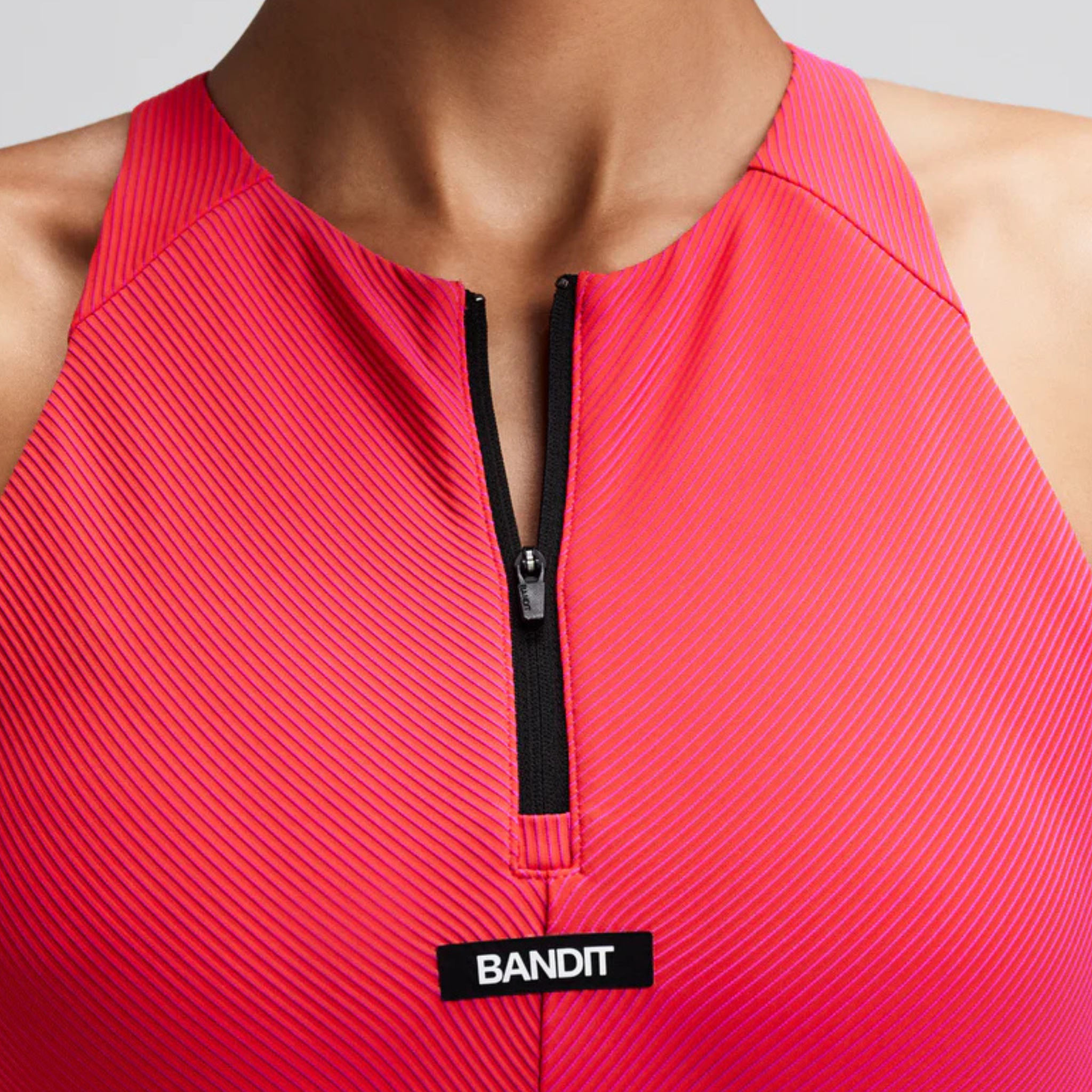 WOMEN'S STRIPED CADENCE ZIP FRONT RACE CROP